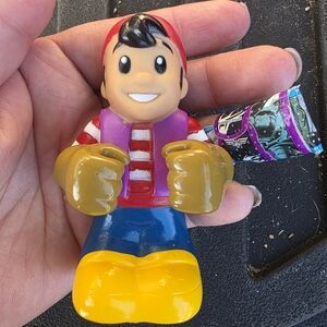 Colorful Action Figure with Red Cap and Yellow Boots